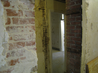 First Floor--From original staircase looking south east through wall to corridor - October 11, 2010