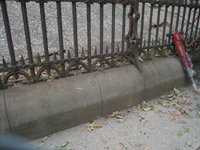 Fence--Detail--Removal of cement from bottom of fence on Pennsylvania Ave. side - October 19, 2010