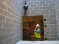 Miscellaneous--Stair elements being lifted into building through the elevator shaft on the second floor - November 1, 2010