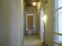 First Floor--Encapsulating plaster complete in the east corridor (ready for skim coat) - November 19, 2010