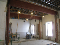 Second Floor--Large central room with large I-beams and finished plaster, with columns looking east - January 20, 2011