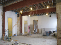 Second Floor--Large central room with large I-beams and finished plaster, from southwest corner of the room - January 20, 2011