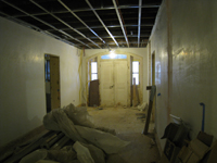 Ground Floor--New concrete floors and plaster in corridor looking south towards south exit - February 1, 2011