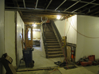 Ground Floor--New concrete floors and plaster in corridor looking north towards north exit - February 1, 2011