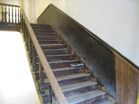 Third Floor--Sanded and unsanded railing for the central staircase (note the two alternating woods in the chair rail) - March 15, 2011