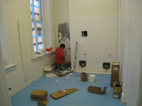 First Floor--East bathroom walls being tiled - March 30, 2011