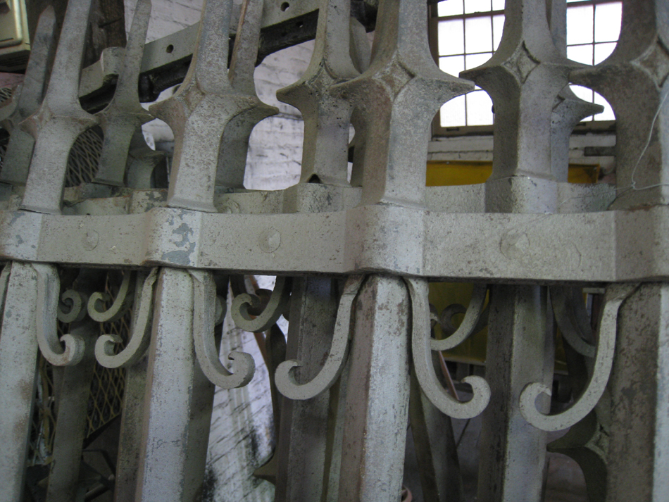 Fence - at G. Krug and Sons - detail of fillets (scrolls) and horizontal bars after sandblasting.