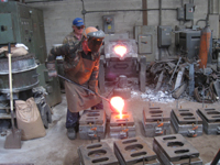 Fence -- Swiss Foundry -- pouring metal for fence elements into molds - September 28, 2010