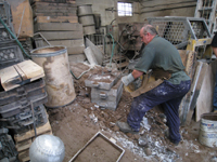 Fence -- Swiss Foundry -- extracting fence elements from cooling molds.