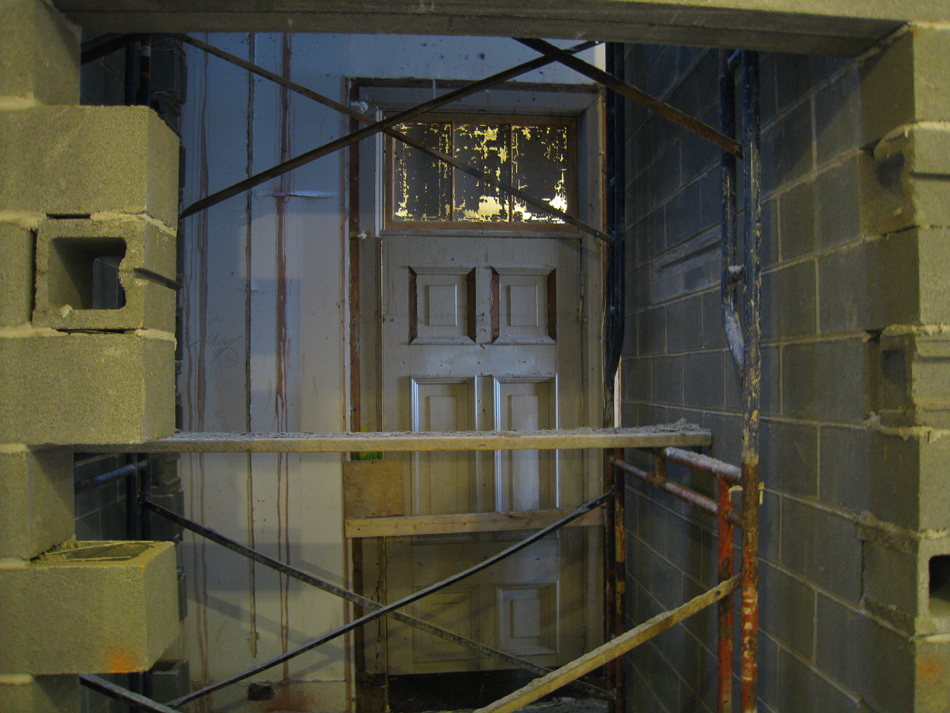 First Floor--North west corner room, looking through elevator shaft to elevator door