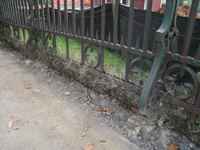 Fence--Detail--Removal of cement from bottom of fence on Pennsylvania Ave. side - October 19, 2010