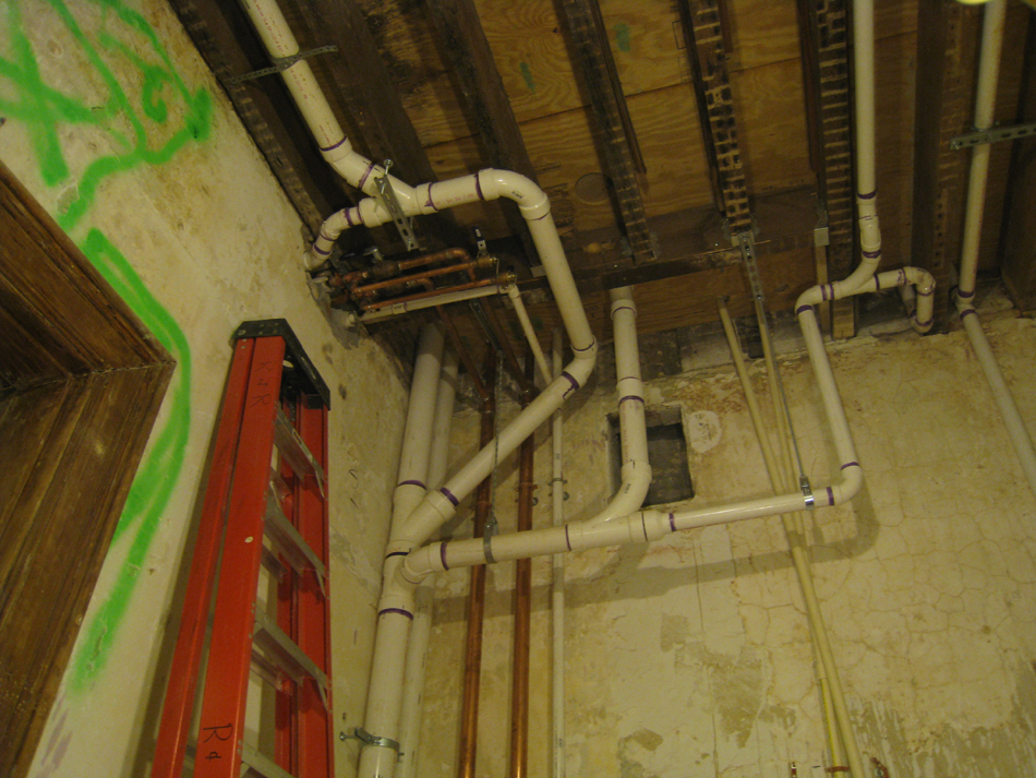 First Floor--Plumbing and heating pipes in room just west of north entrance