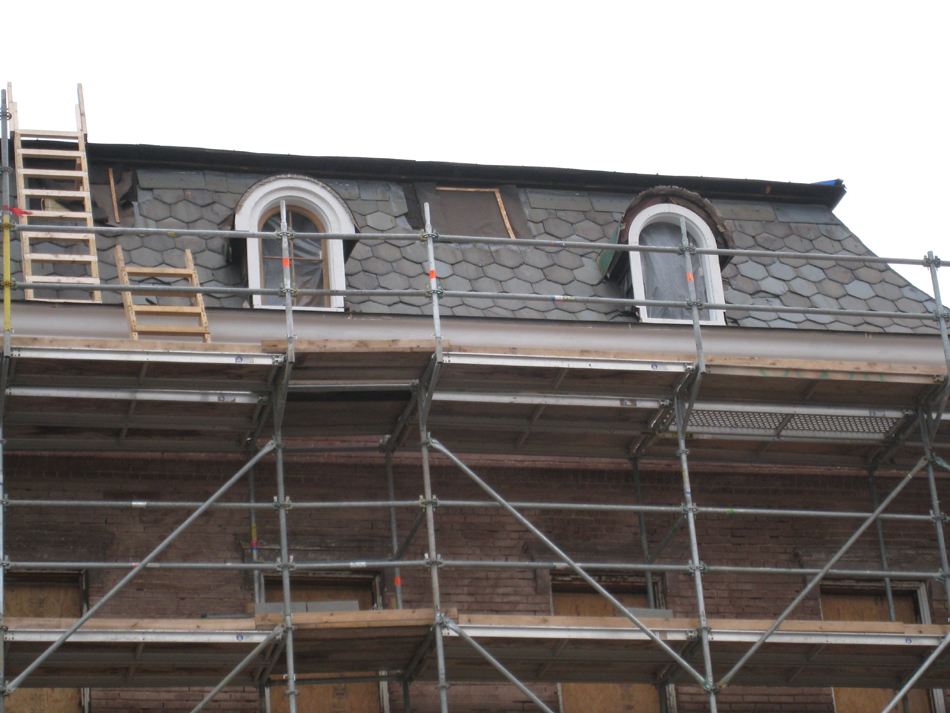 Elevation--West side showing restoration of third floor windows in progress