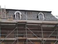 Elevation--West side showing restoration of third floor windows in progress - December 2, 2010