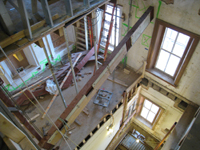 Third Floor--Looking down east stairwell as beam is being raised into place - December 2, 2010