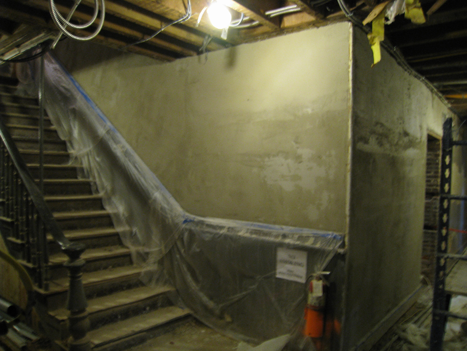 Ground Floor--Stairwell with brown coat plaster - January 20, 2011
