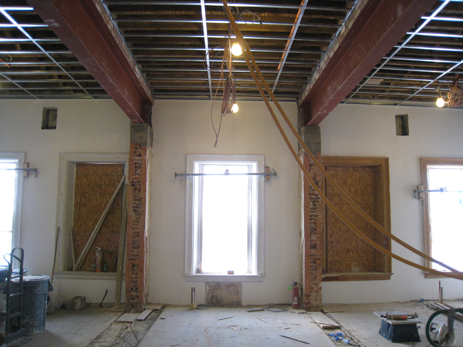 Second Floor--Large central room with large I-beams and finished plaster, looking south from central entrance - January 20, 2011