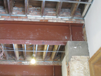 Second Floor--Large central room with large I-beams and finished plaster--detail of original column, beam and brickwork - January 20, 2011