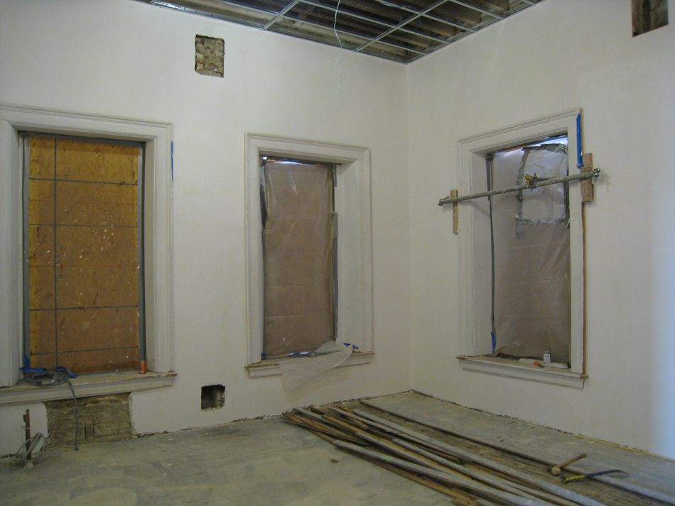 Second Floor--Northwest corner room with original floor (left) exposed after removing later flooring (right) - January 20, 2011