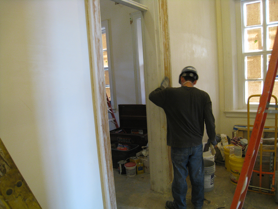 First Floor--Scraping and repairing door frames in corridor on east end - March 3, 2011