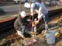 Fence--Drilling anchor holes in existing fence foundation for installation - March 18, 2011