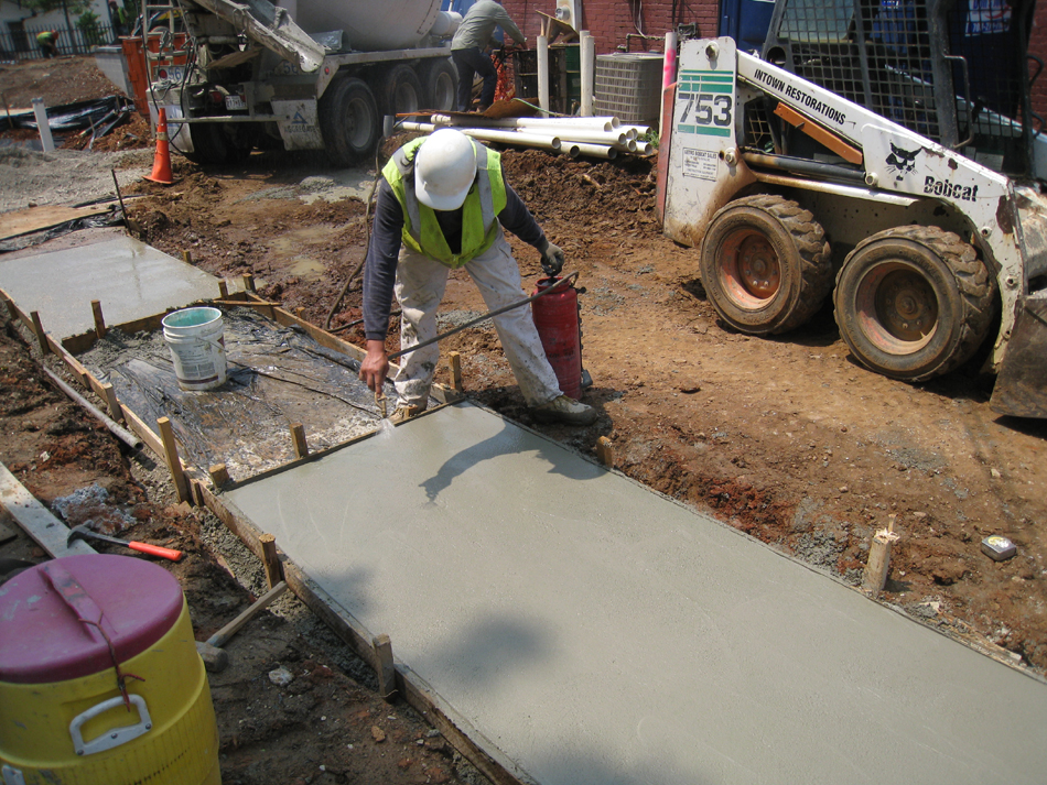 Grounds--Applying drying inhibitor to concrete - June 10, 2011