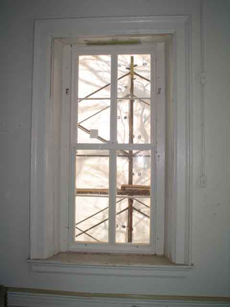 These double-hung windows feature the restored sashes, new weather stripping, interior 
storm panels and the existing windows lites as they were taken out.